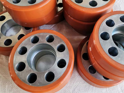 Material handling equipment with polyurethane-coated wheels 